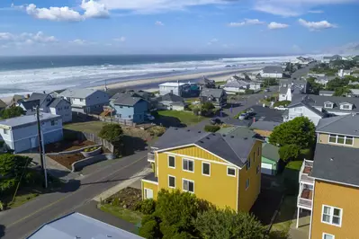 Welcome to Pacifica, the expansive yellow home in the center of the picture.