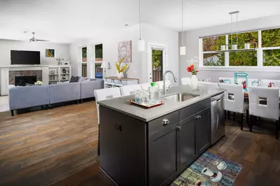 Lots of space in the living room to the kitchen and dinning room for seating and for playing board games and just spending time with the whole family.