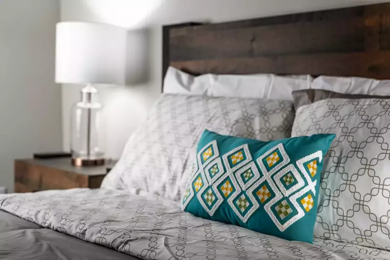 Main level bedroom with freshly washed linens