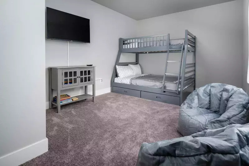 Twin over full bunk bed, as well as a 4K LED TV connected to a gaming system for any who may wish to partake.