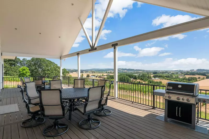 The pictures of the views from the large back deck don’t do it justice at all. It sits on a hilltop, with vines surrounding and panoramic views of vin