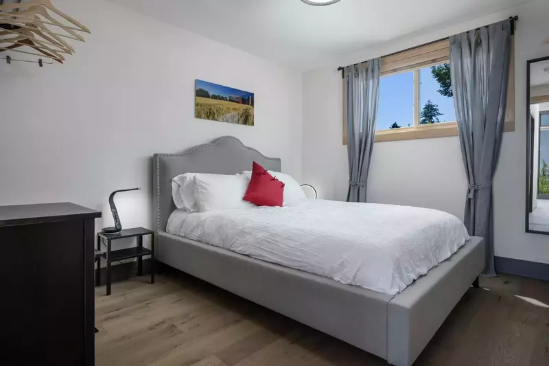 One of four bedrooms with queen beds all with independent heating and a/c.