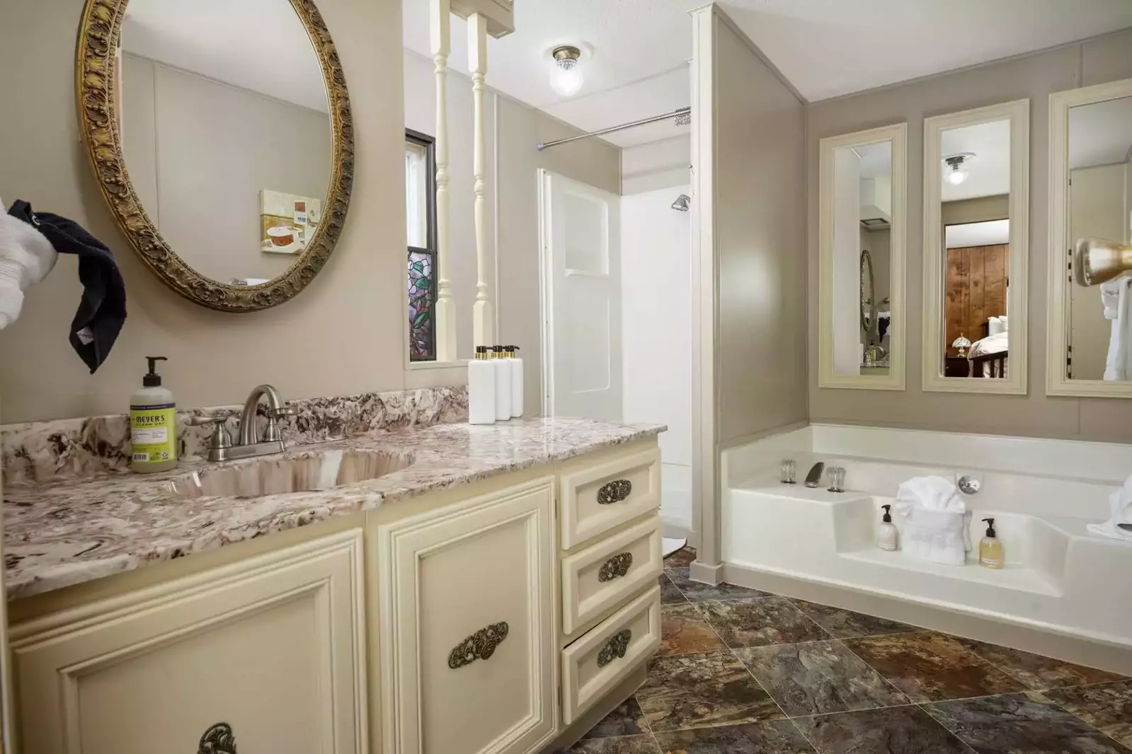 Spacious and bright bathroom with soaking tub for relaxation.