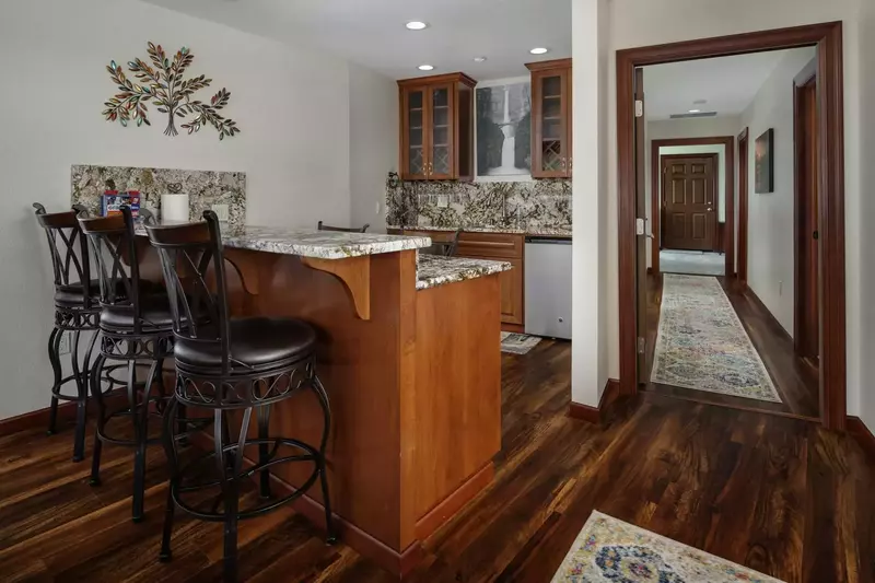 The wet-bar just off the kitchen is another perfect gathering spot for your group to enjoy.