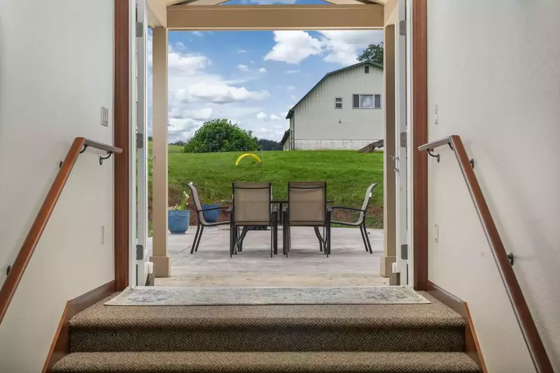 This wide hallway and double doors lead out onto the huge patio.