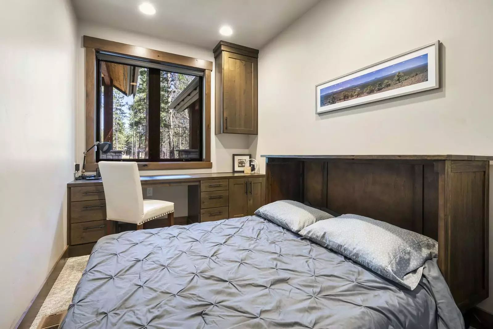 The room has a home office set up.