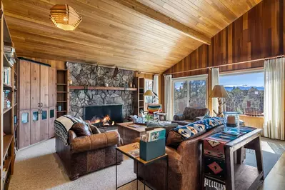 Relax in front of a cozy fire while enjoying the view.