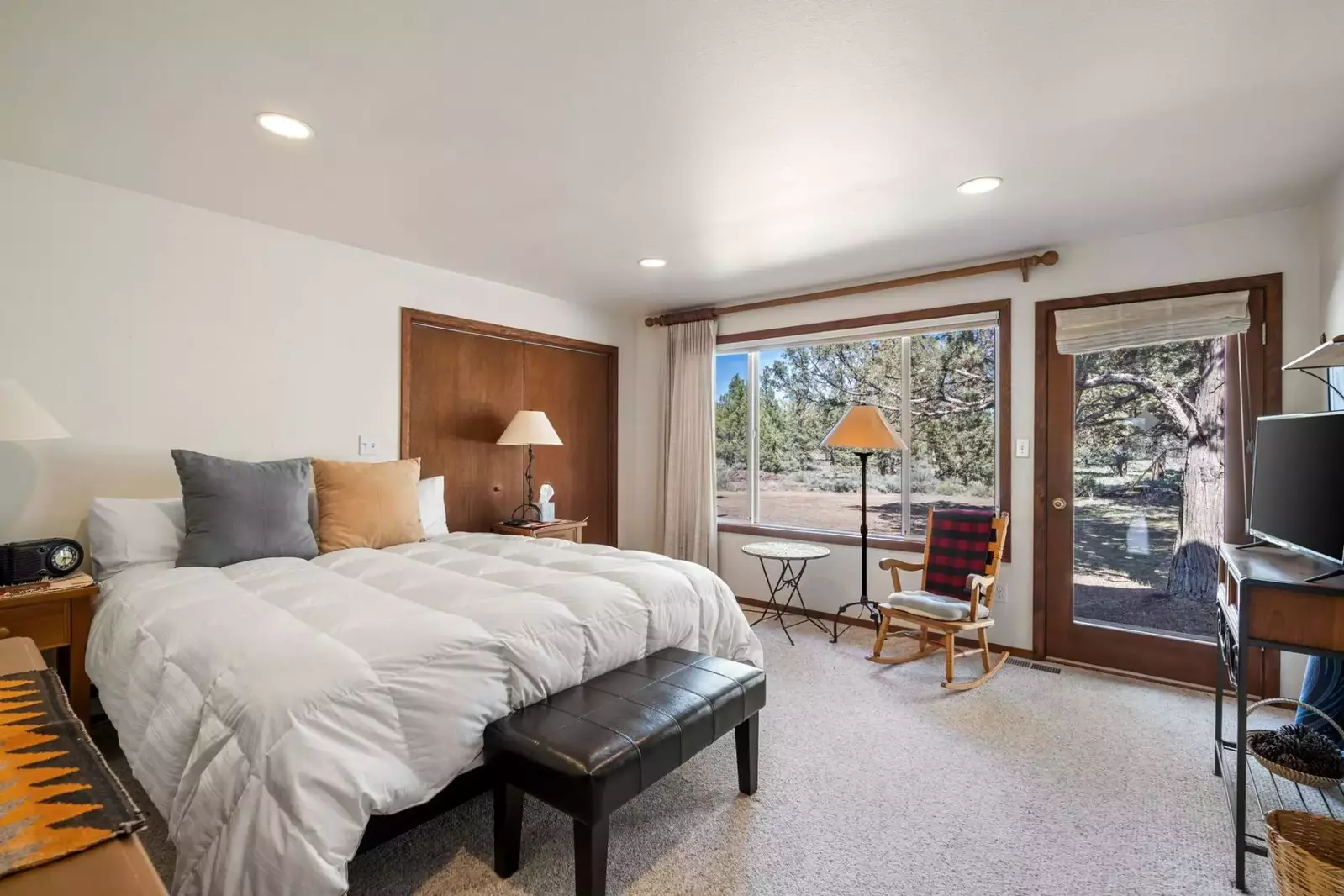 This bedroom has a king bed, tv, lovely view, and is very spacious.