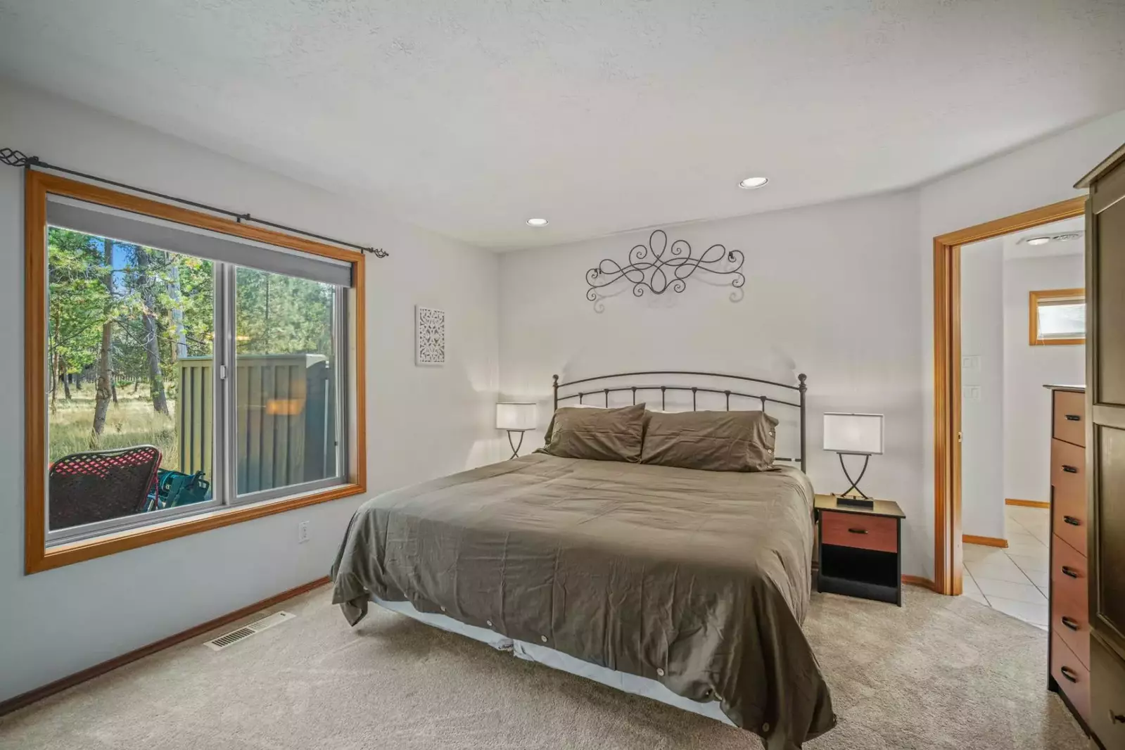 Primary suite with king bed includes it's own private bathroom.