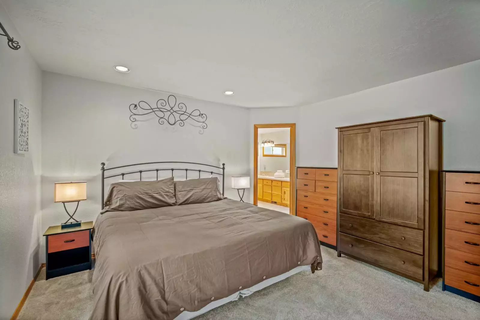 The primary suite offers plenty of clothing storage space.