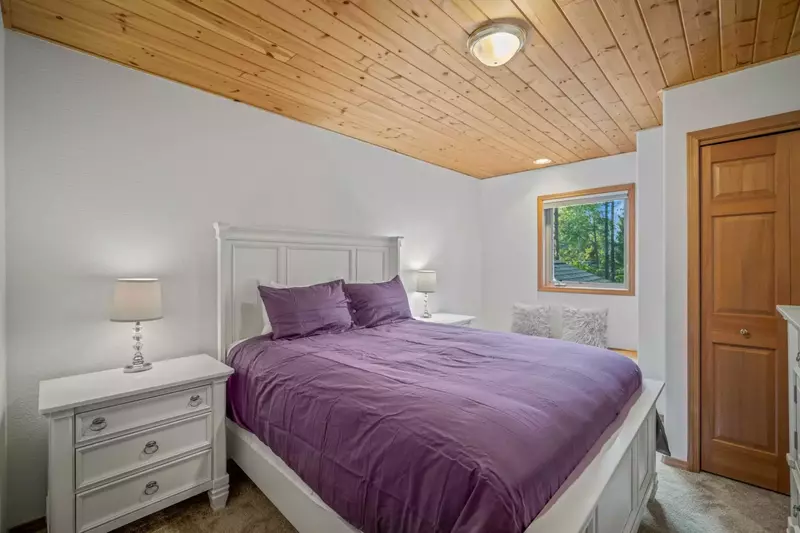 Full bed bedroom with ample clothing storage.