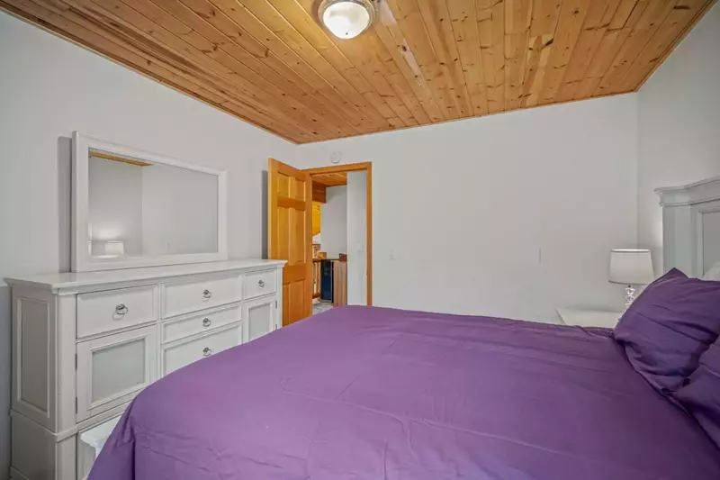 View from full bed bedroom out towards hall.