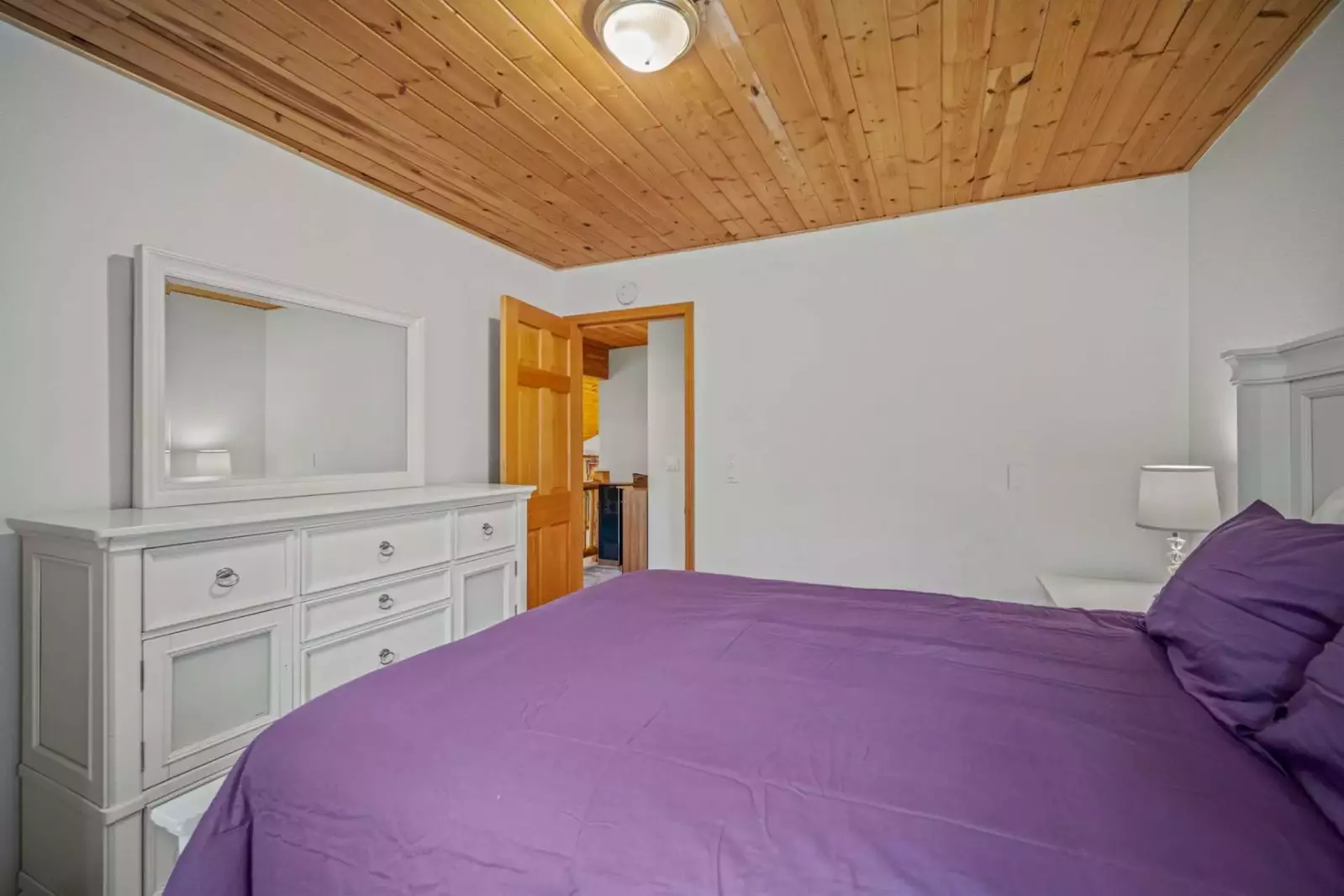 View from full bed bedroom out towards hall.