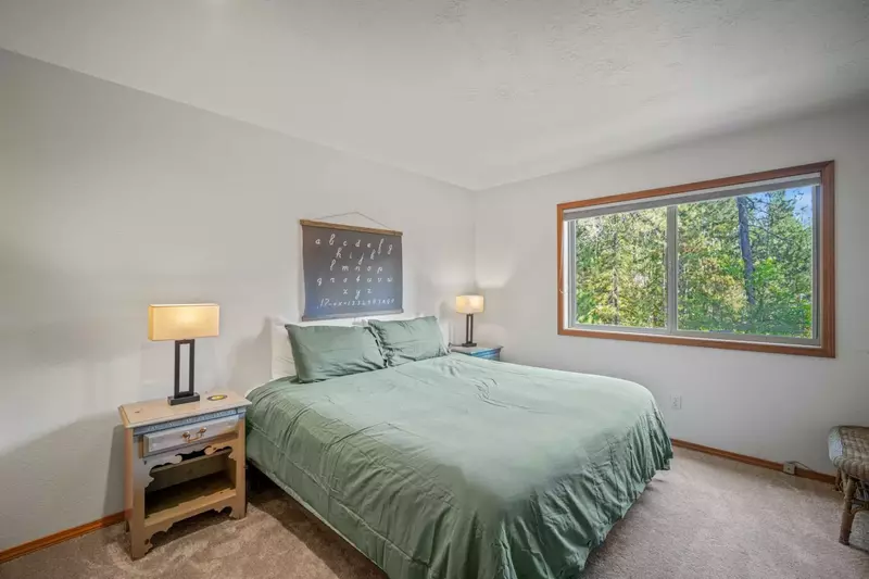Queen bedroom offers cozy outside views.