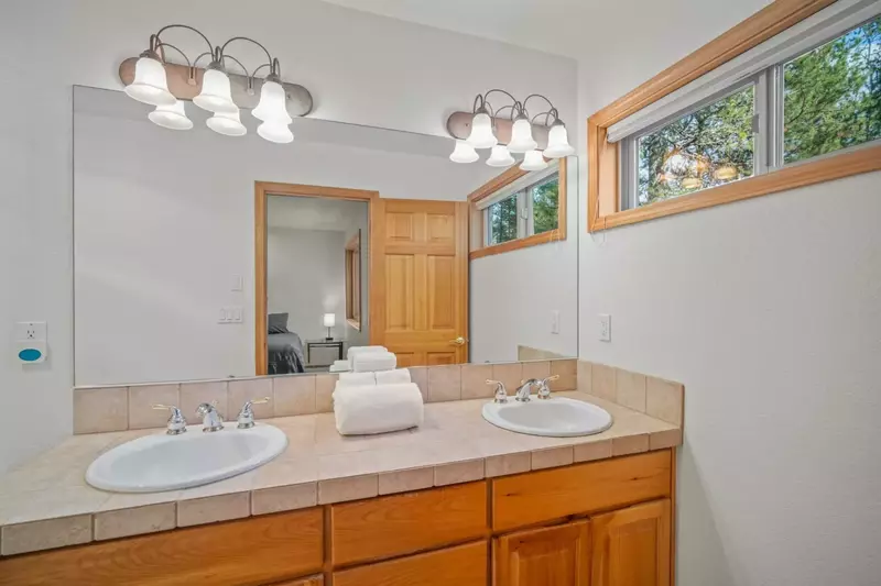 Second primary bedroom's private bathroom with dual sinks.