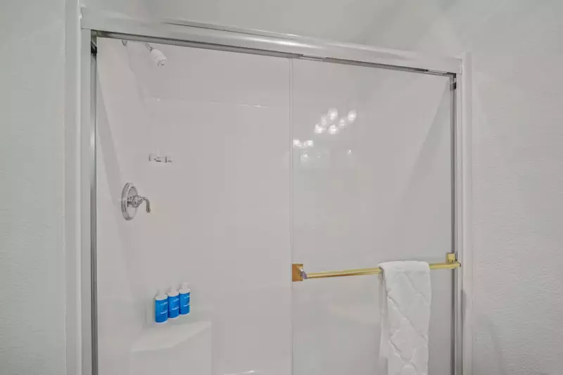 Second primary bedroom's private bathroom shower.