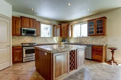Spacious, open floorplan anchored by a gourmet kitchen.