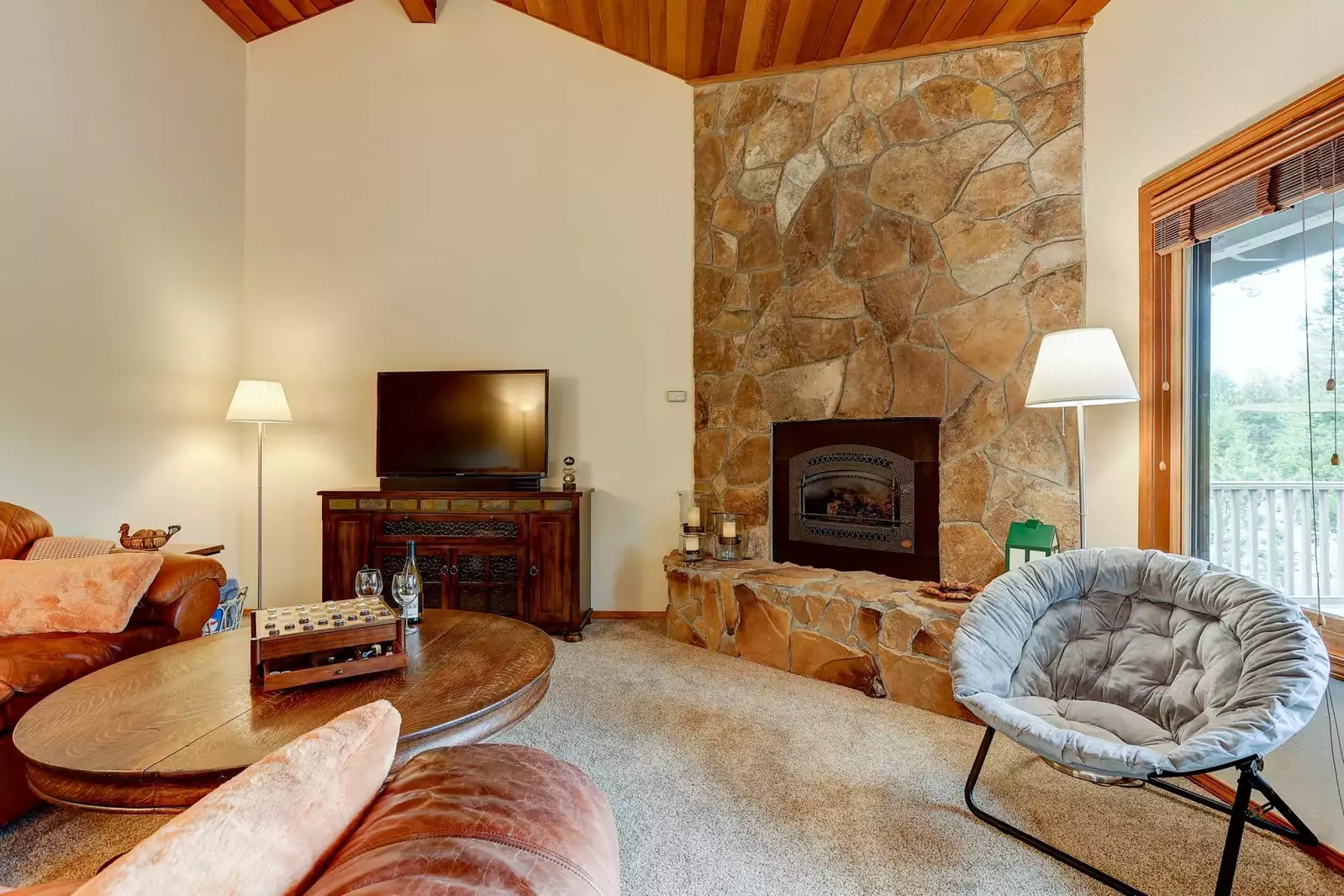 Beautiful stone gas fireplace in the living room.