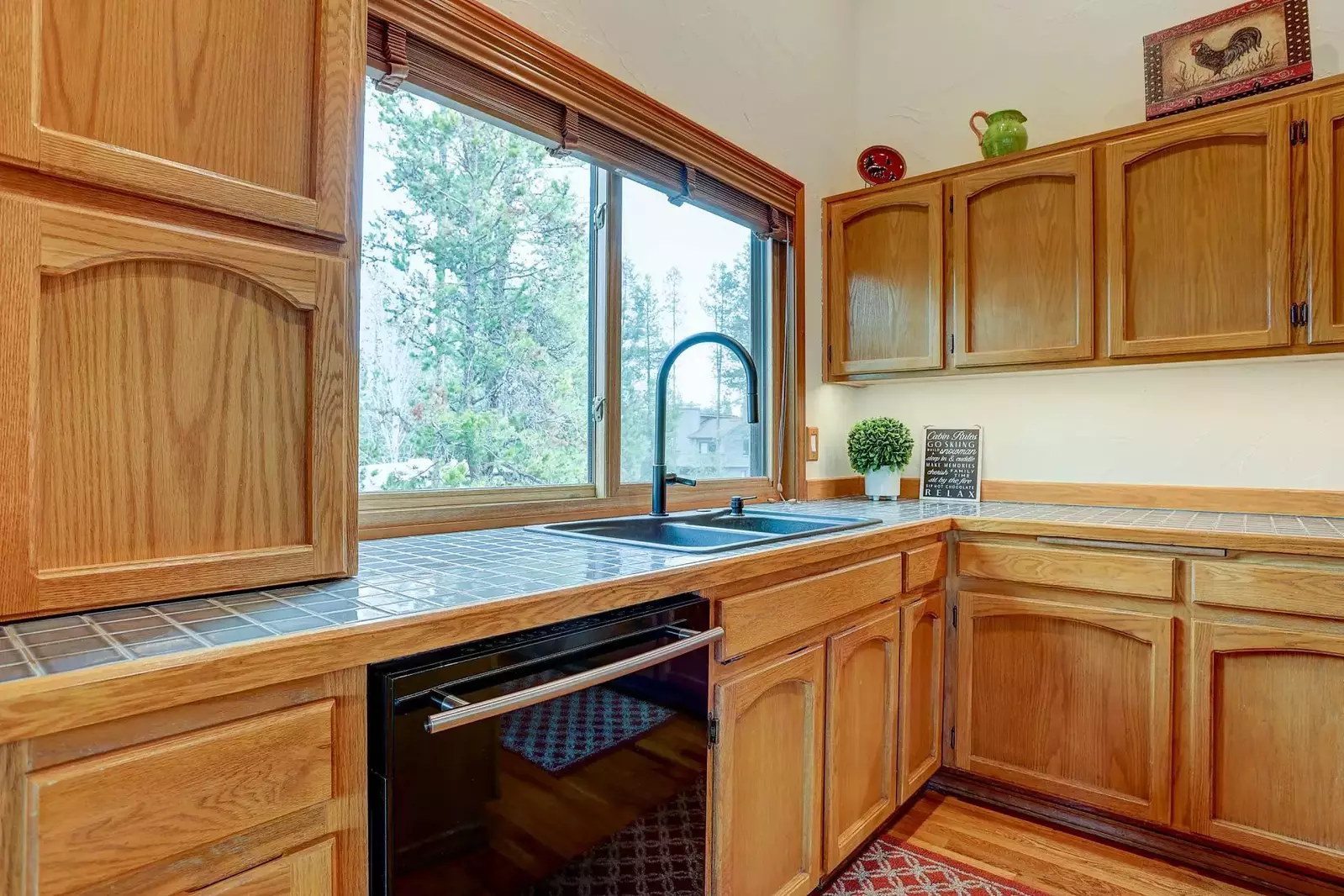 Tiled countertop and custom cabinetry.