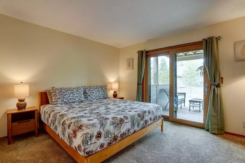 Master bedroom with access to lower-level deck.