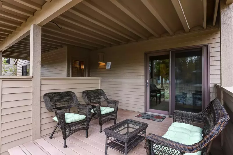 Lower deck next to the hot tub offers comfort and shade.