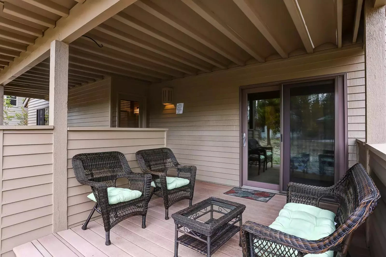 Lower deck next to the hot tub offers comfort and shade.