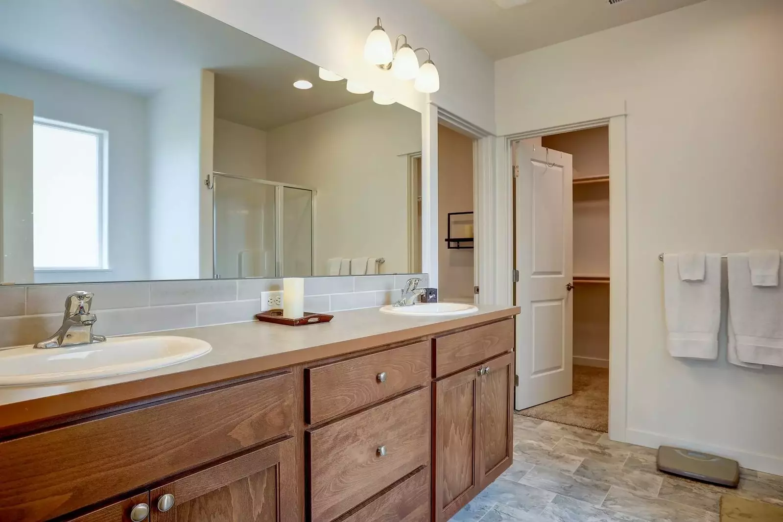 Master bath with dual sinks, walk-in shower and tub