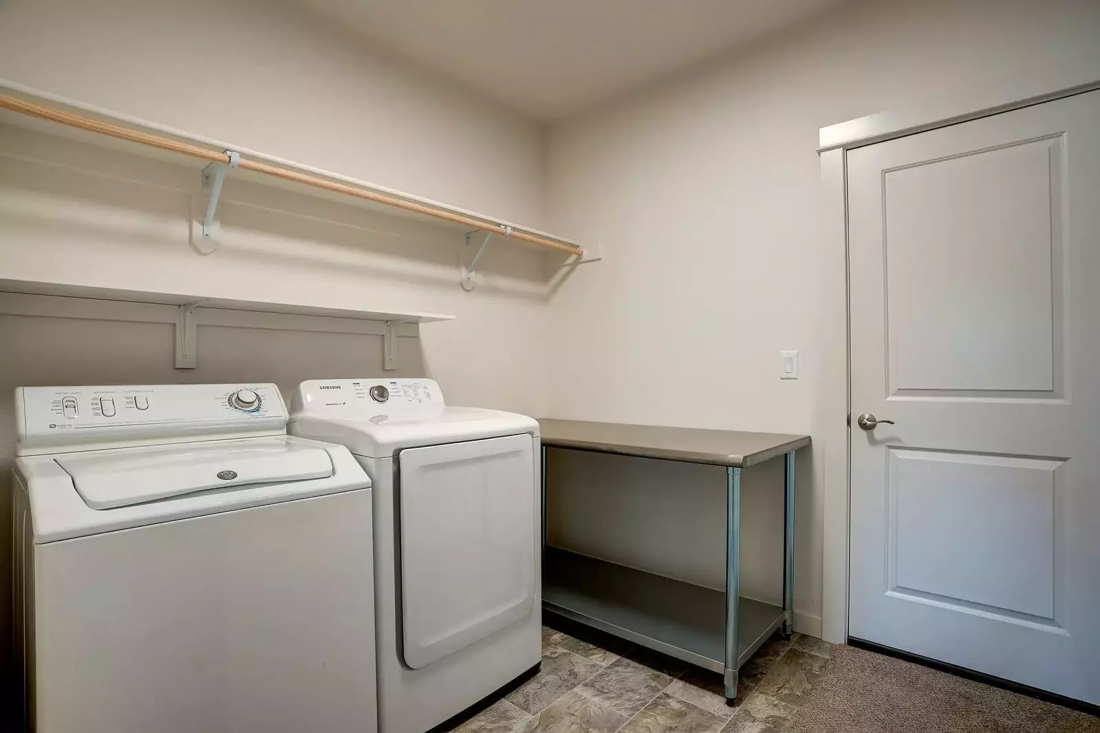 Full size washer and dryer in laundry room