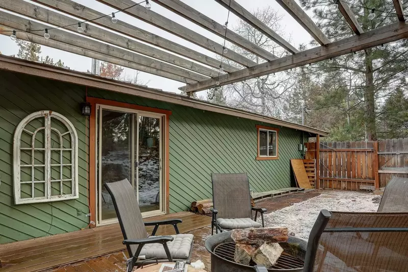 Private setting in back includes a cozy firepit and propane grill.