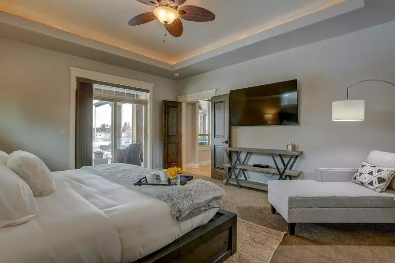 Master Suite offers King-sized bed, 54" flat screen TV and private access to extended deck