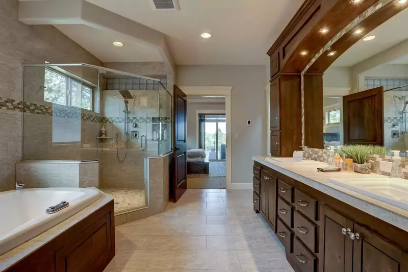 Master en suite spoils its guests with large walk-in shower, soaking tub, and radiant floor heat