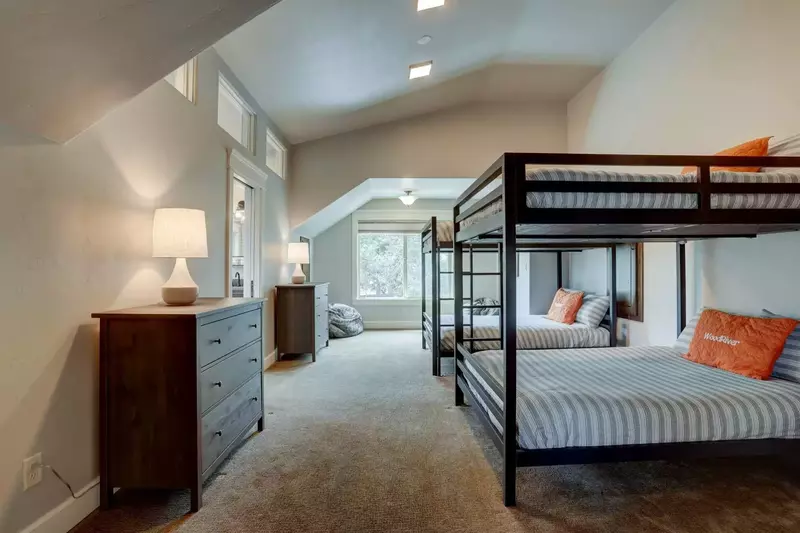 Four full-size bunks, spacious privacy, vaulted ceiling, and new adjoining bathroom.