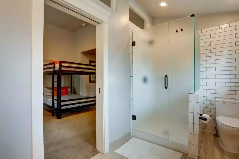 Modern walk-in shower for the comfort of the bunkers.