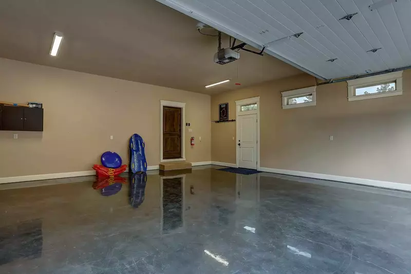 Bring your toys. Heated garage with epoxy finished floor. 2 parking spots.