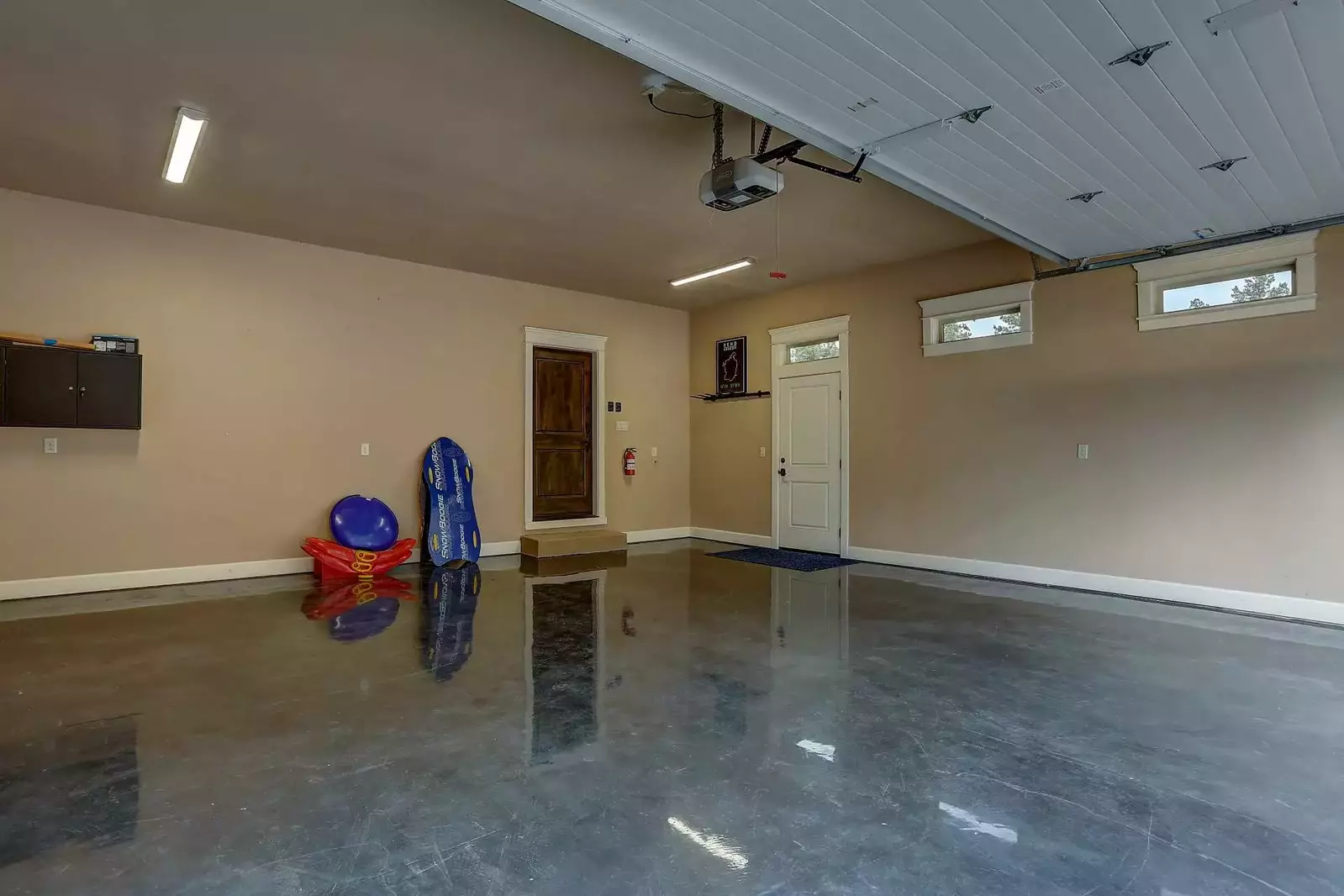 Bring your toys. Heated garage with epoxy finished floor. 2 parking spots.