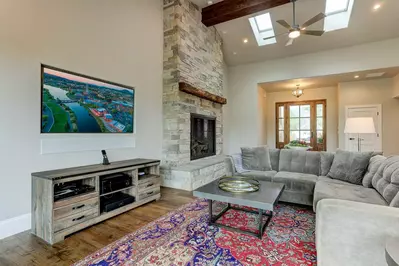 Relax surrounded by vaulted ceiling, flat screen television with cable access and comfortable seating.