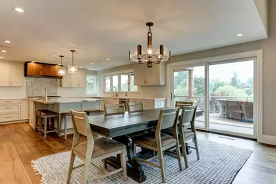 Prepare meals in a fully stocked Chef’s paradise with sweeping views of the river and Columbia Bridge.