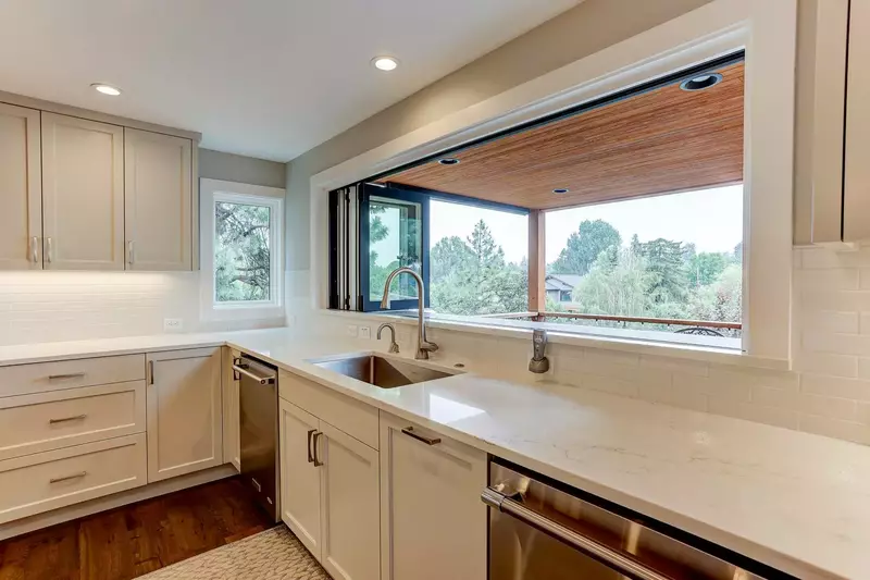 This Chef's kitchen includes: two dishwashers, quartz countertops, coffee/tea station along with a 10ft serve thru window for indoor/outdoor enjoyment