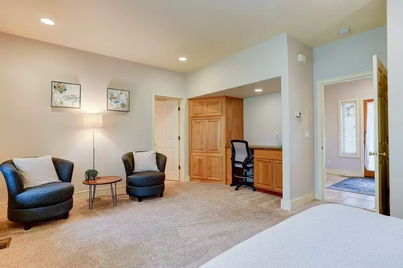 Relax downstairs, or get some work done in this workspace with printer.