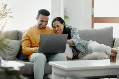 couple browsing on computer