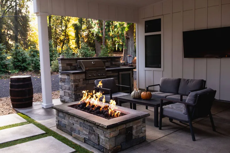 The lovely patio area has a grill, tv, and fire pit.