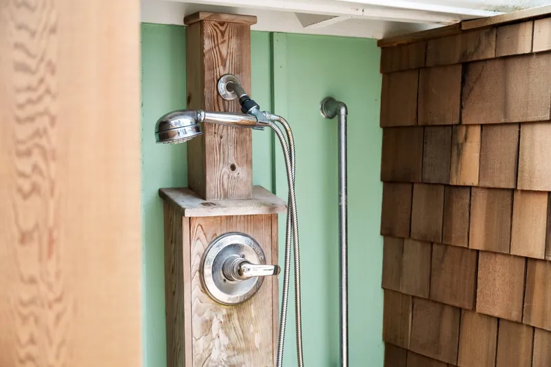 An outdoor shower to wash off in after a fun day on the beach.