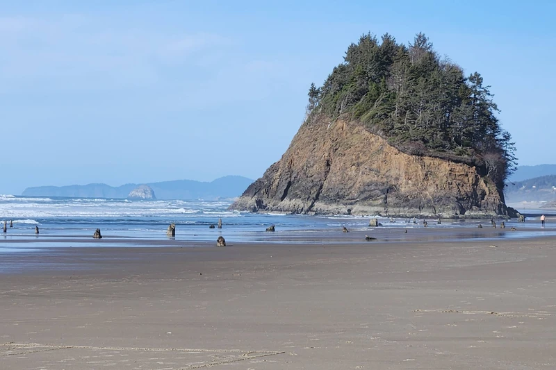 Iconic Neskowin coastline views with dramatic sea stacks, open beach, and unforgettable Oregon sunsets.