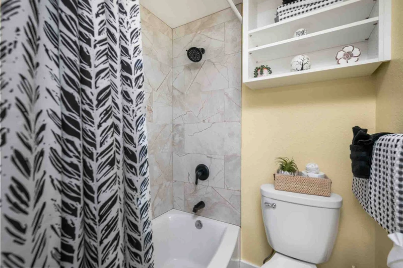 The bathroom is recently updated and ornately decorated.