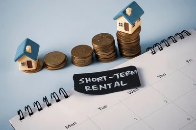 model of short term rental houses with coins